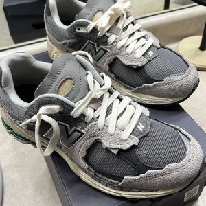 New Balance 2002R (rain clouds). Brand new. Worn around the house. I paid $280.